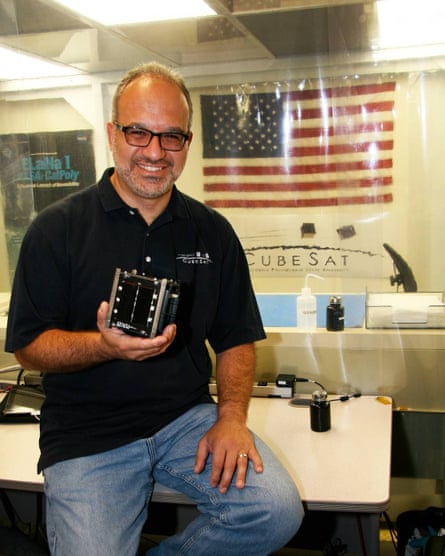 Jordi Puig-Suari holds CubeSat, which he invented with Stanford professor Bob Twigs.