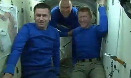 From left: Commander Yuri Malenchenko, NASA's Tim Cobra and Major Tim Beck on the Soyuz capsule.