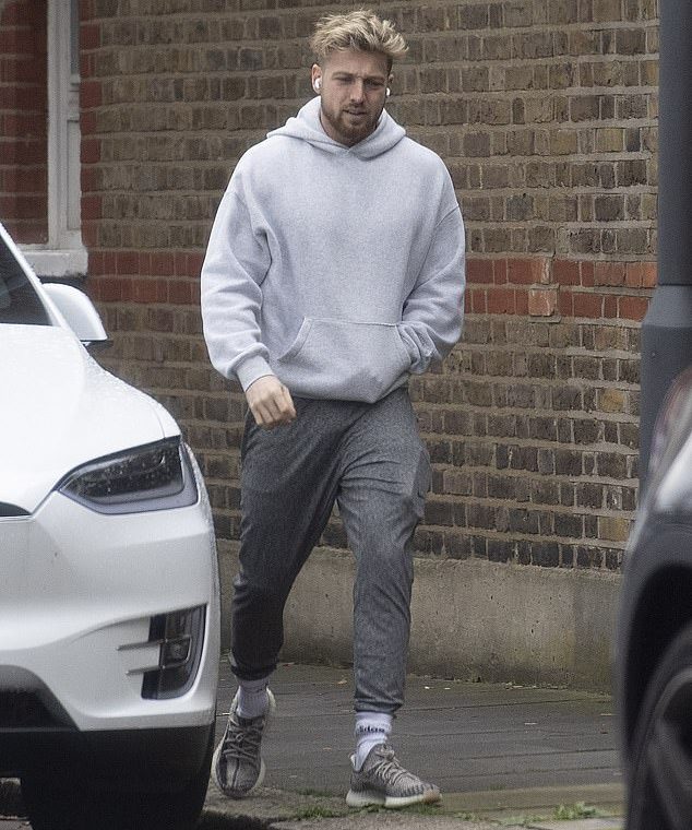 Gripped: Sam Thompson definitely looked like he had a lot to think about when he got out of London on Tuesday, looking sad just hours after scenes showing the final chapter in his breakup with Zara McDermott that aired on Made In Chelsea
