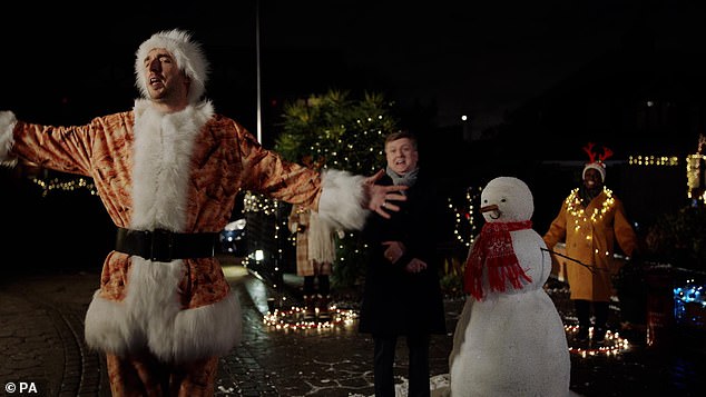 Comedian and YouTube star LadBaby (pictured left) joined East 17's Tony Mortimer and Walking In The Air singer Aled Jones (pictured center) in a Walkers Christmas commercial