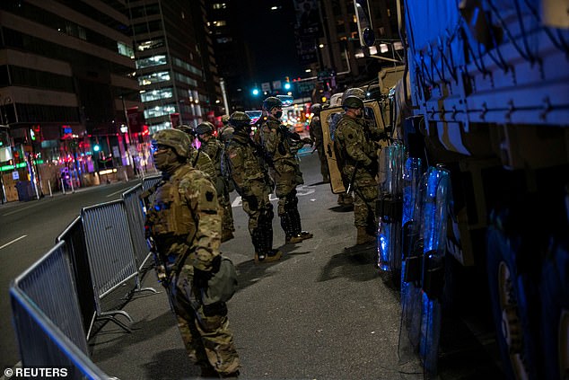 National Guard members stand near Philadelphia City Hall after police investigate an alleged plot to attack the vote counting venue
