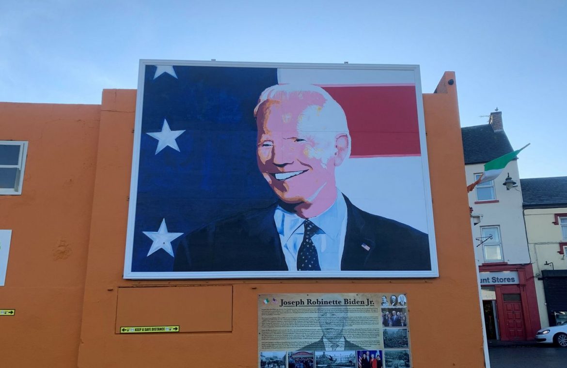 A mural of Joe Biden looks over Market Square in Ballina