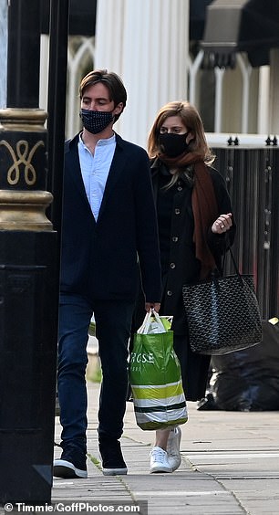 The couple, who are currently staying at Beatrice's apartment at St. James's Palace, carried three shopping bags loaded along the sidewalk.