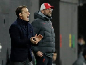 Fulham coach Scott Parker cheers on his players after a good start