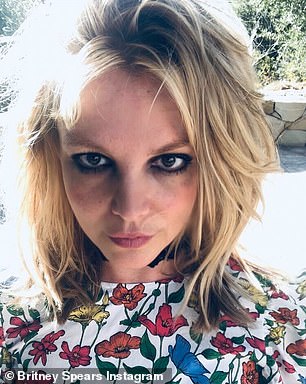 cut it!  Britney looked elegant in close-ups, wearing a cute floral blouse with fine dryer hair