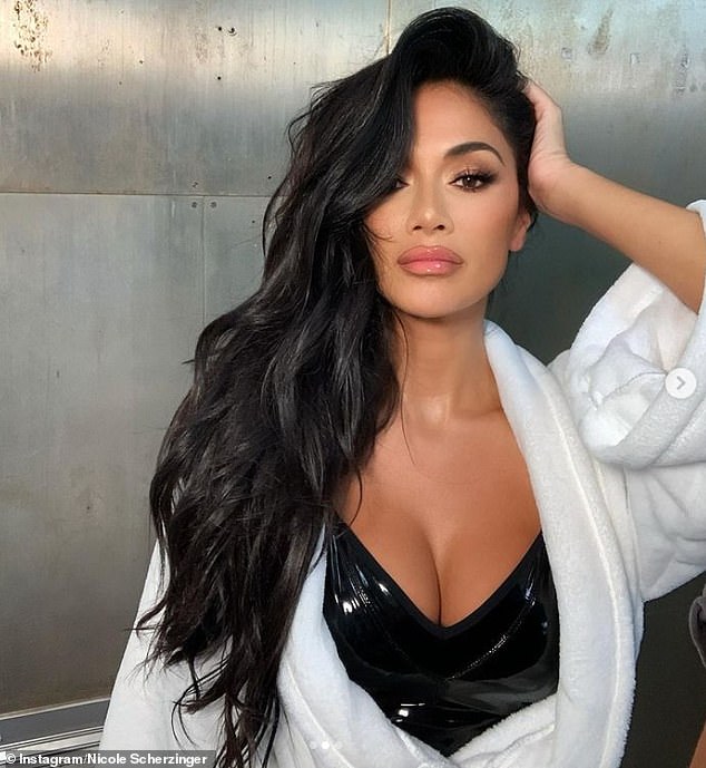 Racy: Nicole Scherzinger looked stunning when she showed off her wide cleavage in a PVC dress on Sunday