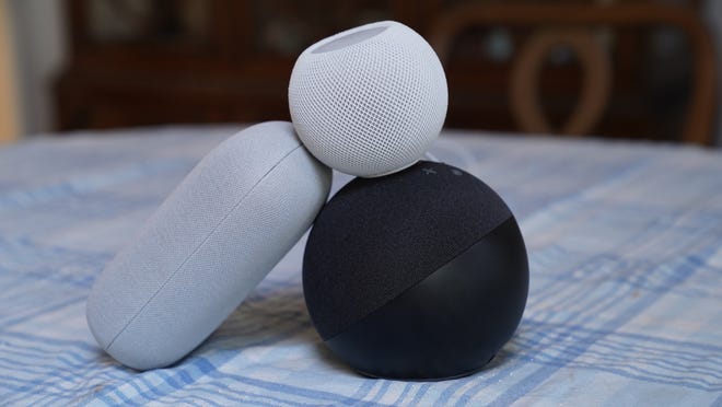 Google Nest Audio, on the left, Amazon Echo, below, and Apple's HomePod Mini at the top.