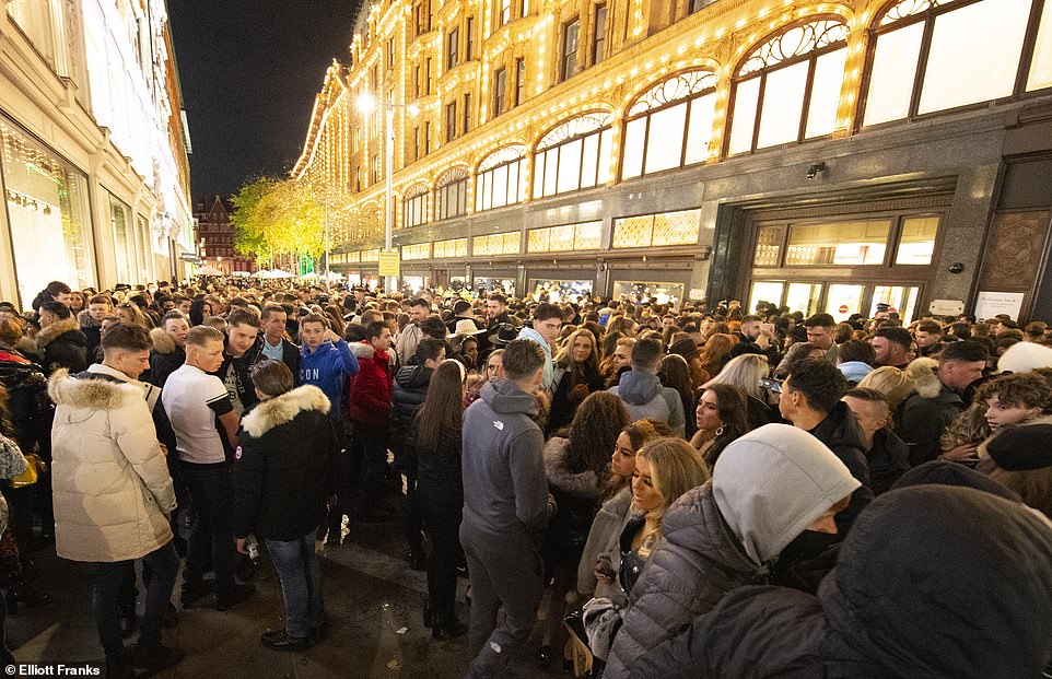 Hundreds of young men tried to enter the luxury department store Harrods in Knightsbridge, London today and crowded together on the streets outside.