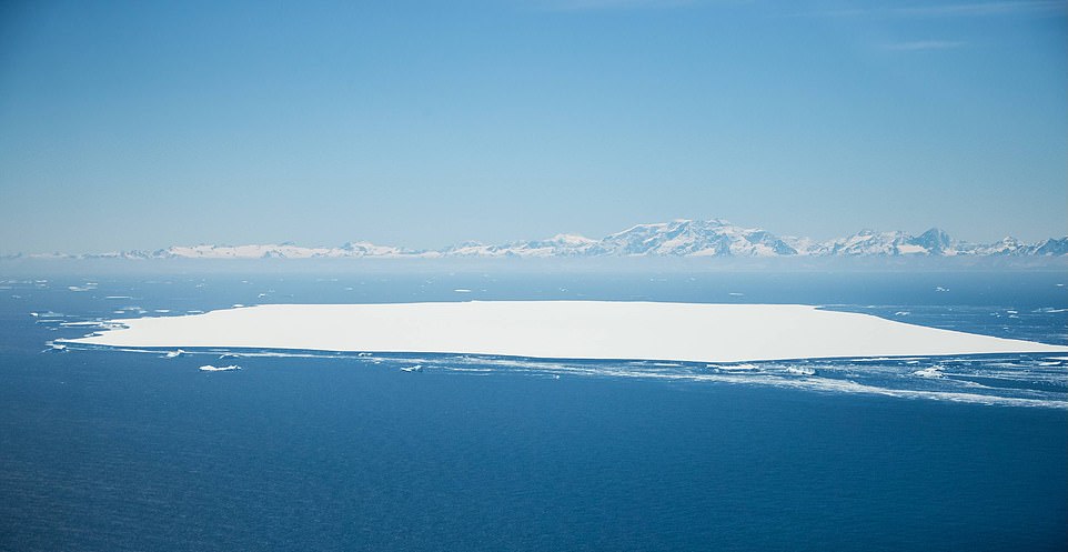 Pictured is A68d north of the main iceberg, and in the background is an endangered island in South Georgia