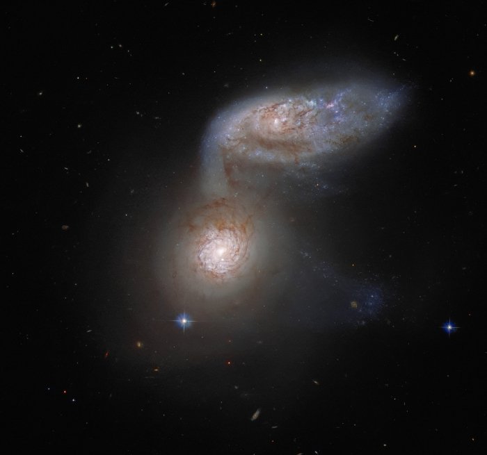 Galaxies collide.  Unusual photo of the Hubble telescope