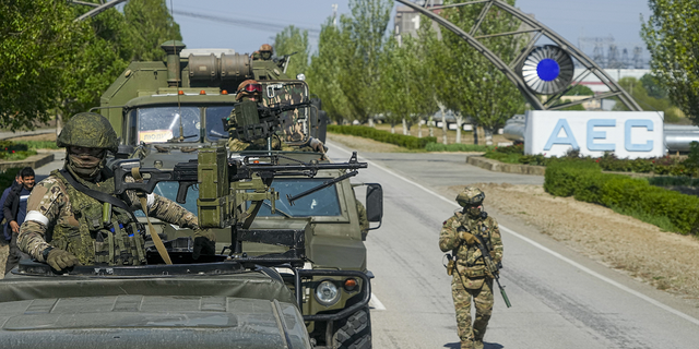 A Russian military convoy stands on its way to the Zaporozhye nuclear power plant in southeastern Ukraine on Sunday, May 1. 