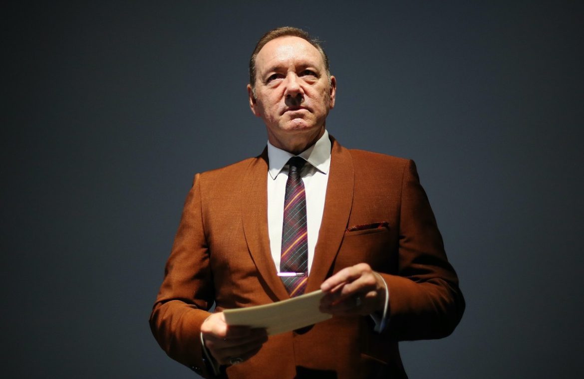 There will be no delivery.  Kevin Spacey will appear in a British court